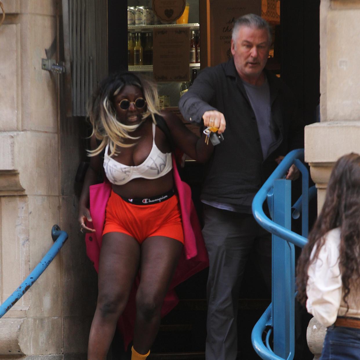 Crackhead Barney and Alec Baldwin scuffle over her phone outside the NYC coffee shop Monday. Said Elatab / SplashNews.com