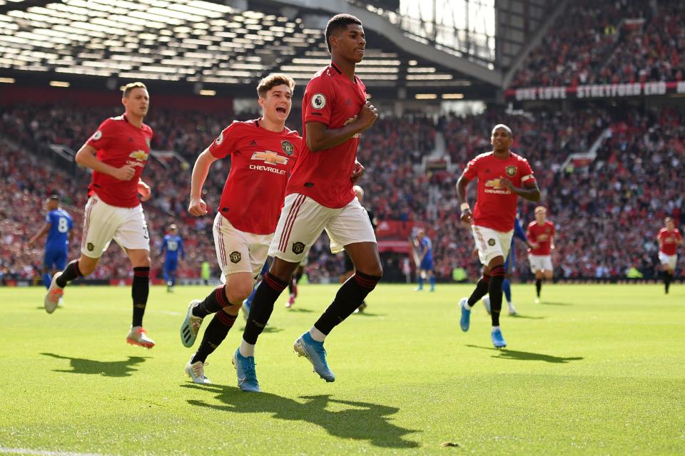 Manchester United's English striker Marcus Rashford (C) celebrates with teammates after scoring the opening goal of the English Premier League football match between Manchester United and Leicester City at Old Trafford in Manchester, north west England, on September 14, 2019. (Photo by Oli SCARFF / AFP) / RESTRICTED TO EDITORIAL USE. No use with unauthorized audio, video, data, fixture lists, club/league logos or 'live' services. Online in-match use limited to 120 images. An additional 40 images may be used in extra time. No video emulation. Social media in-match use limited to 120 images. An additional 40 images may be used in extra time. No use in betting publications, games or single club/league/player publications. /         (Photo credit should read OLI SCARFF/AFP/Getty Images)