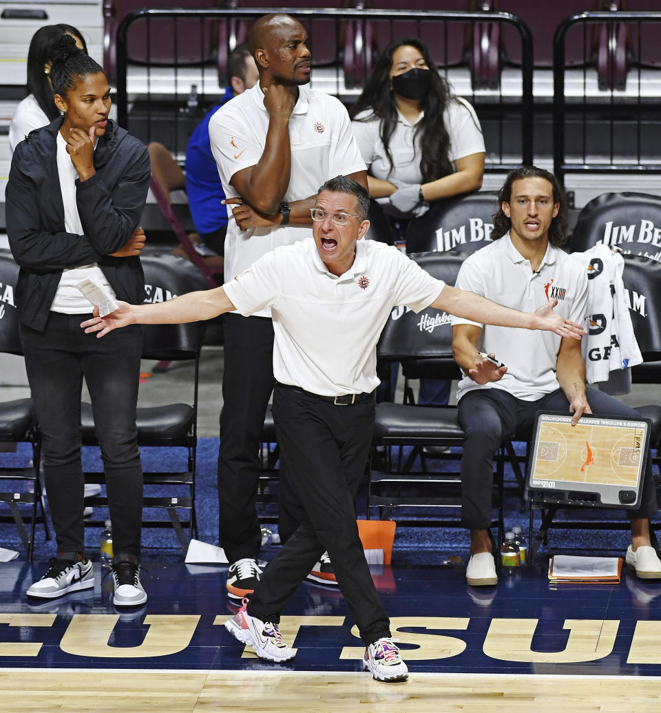 FILE - Connecticut Sun head coach Curt Miller looks for a traveling call on an Atlanta Dream player during a WNBA basketball game in Uncasville, Conn., in this Friday, July 9, 2021, file photo. Sun coach Curt Miller was unanimously chosen as the AP's Coach of the Year, Wednesday, Sept. 22, 2021 .(Sean D. Elliot/The Day via AP, File)