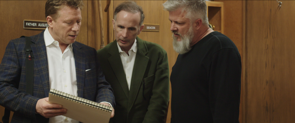 Ed Gavagan (from left), Michael Sandridge and Dan Laurine in a scene from “Procession.” The documentary follows six men, all survivors of childhood sexual abuse, who come together to direct a drama therapy-inspired experiment designed to collectively work through their trauma. 