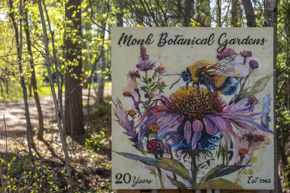 A sign that reads Monk Botanical Gardens is seen May 8 at the gardens in Wausau. On Wednesday, the board of directors for the botanical gardens announced it would reverse its decision to remove the Monk name from the gardens and return to the Monk Botanical Gardens name.