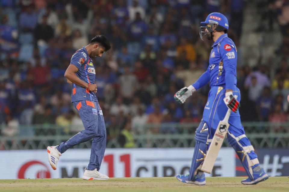 Lucknow Super Giants' Mayank Yadav, left, celebrates the dismissal of Mumbai Indians' Mohammad Nabi, right, during the Indian Premier League cricket match between Lucknow Super Giants and Mumbai Indians in Lucknow, India, Tuesday, April 30, 2024. (AP Photo/Pankaj Nangia)