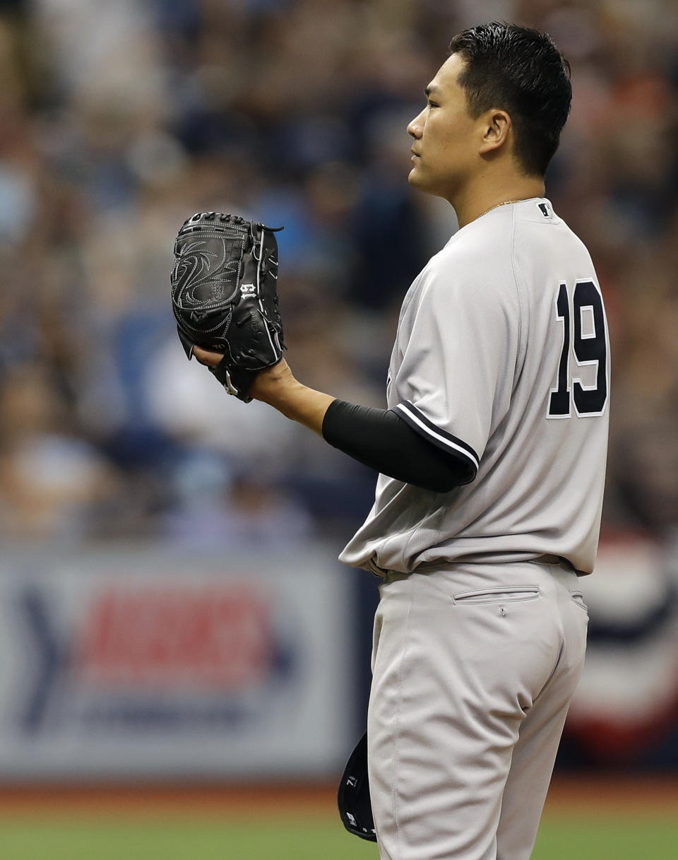 New York Yankees starting pitcher Masahiro Tanaka, of Japan, reacts as Tampa Bay Rays' Logan Morrison runs around the bases after hitting a home run during the third inning of a baseball game Sunday, April 2, 2017, in St. Petersburg, Fla. (AP Photo/Chris O'Meara)