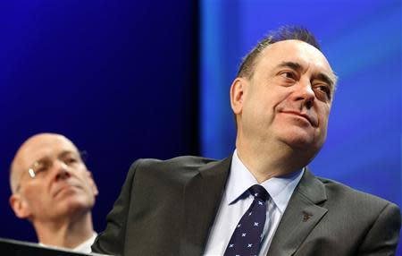 Scotland's First Minister Alex Salmond (R) and John Swinney listen to Deputy First Minister Nicola Sturgeon during her speech at the SNP Spring Conference in Aberdeen, Scotland April 11, 2014. REUTERS/Russell Cheyne