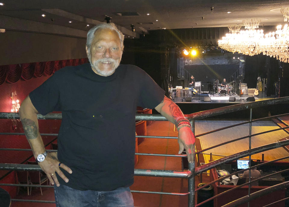 In this Thursday, Sept. 6, 2018 photo, Jorma Kaukonen, 77, poses for a photo as his Hot Tuna bandmates do a sound check before a gig at the El Rey Theatre in Los Angeles. Long before he wrote and recorded the Jefferson Airplane classic "Embryonic Journey," Kaukonen was on a decades-long journey of his own discovery. It began as a globe-circling embassy brat in the 1950s, continued as a psychedelic rock star in the '60s and shows no signs of slowing as the youthful co-founder Hot Tuna guitarist is still recording and touring. He stops long enough to recount much of it in his recent memoir "Been So Long: My Life & Music." (AP Photo/John Rogers)