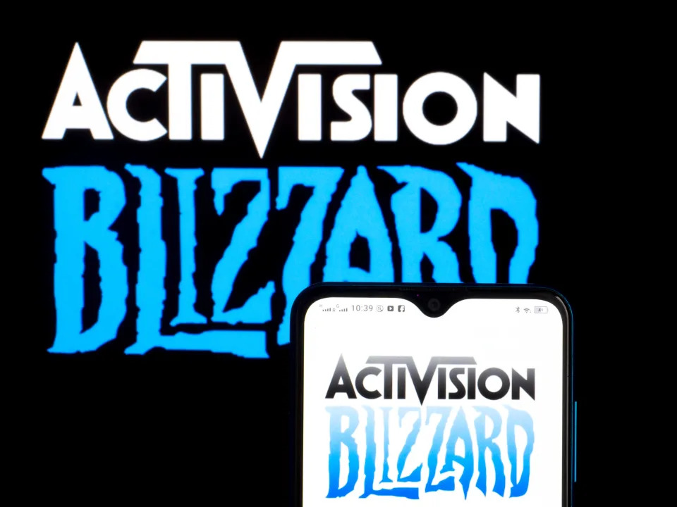 UKRAINE - 2021/09/20: In this photograph  illustration, Activision Blizzard, Inc. logo seen displayed connected  a smartphone and successful  the background. (Photo Illustration by Igor Golovniov/SOPA Images/LightRocket via Getty Images)