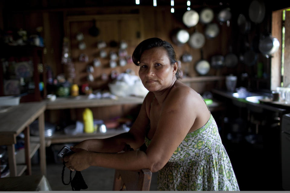 Hilaria Zavala poses for the picture during an interview with The Associated Press in Ahuas, Mosquitia region, Honduras, Monday, May 21, 2012. On Friday May 11, a joint Honduran-U.S. drug raid, on a helicopter mission with advisers from the DEA, appears to have mistakenly targeted civilians in the remote jungle area, killing four riverboat passengers and injuring four others. Later, according to villagers, Honduran police narcotics forces and men speaking English spent hours searching the small town of Ahuas for a suspected drug trafficker and detaining several villagers. Zavala said six men kicked in her door about 3 a.m., threw her husband on the ground, put a gun to his head and then took him away for two hours.(AP Photo/Rodrigo Abd)