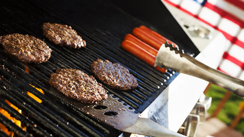 US flag behind grilling meats