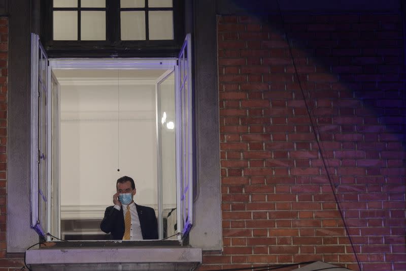 Romanian PM and leader of PNL, Ludovic Orban, speaks on the phone before first exit polls