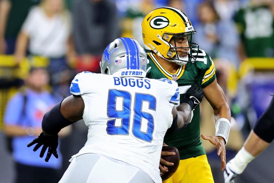Lions defensive lineman Isaiah Buggs sacks Packers quarterback Jordan Love during the first quarter on Thursday, Sept. 28, 2023, in Green Bay, Wisconsin.