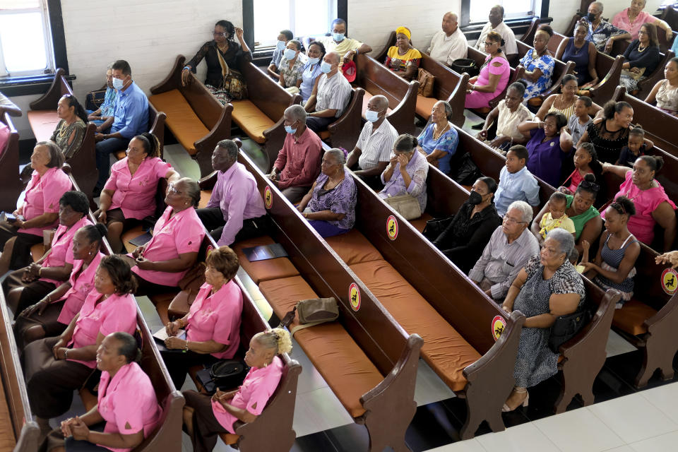 Parishioners attend a service at First Baptist Church on Colombia's San Andres Island on Sunday, Aug. 21, 2022. The church is a source of pride for the Raizals, the English-speaking, mostly Protestant inhabitants of San Andres and smaller islands that form an archipelago in the western Caribbean. (AP Photo/Luis Andres Henao)