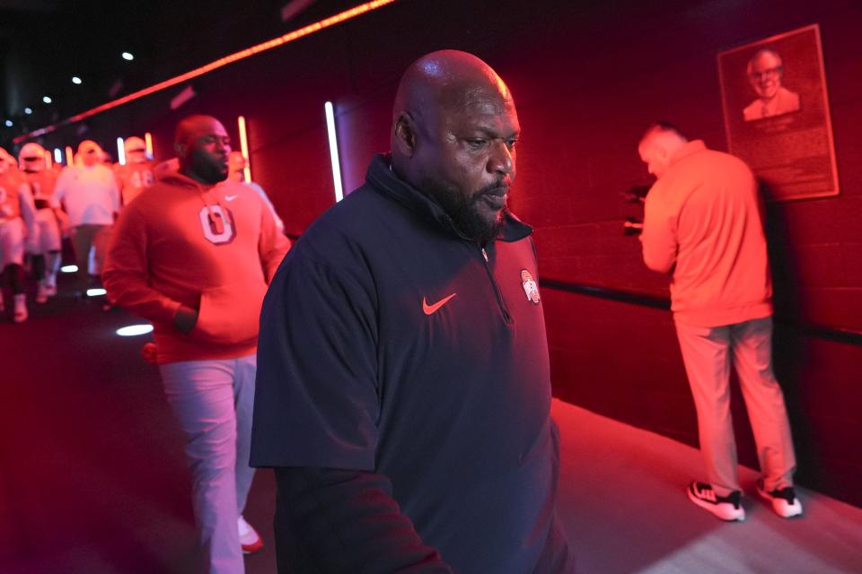 Nov 4, 2023; Piscataway, New Jersey, USA; Ohio State Buckeyes defensive line coach Larry Johnson walks to the field for warm-ups during the NCAA football game against the Rutgers Scarlet Knights at SHI Stadium. Ohio State won 35-16.