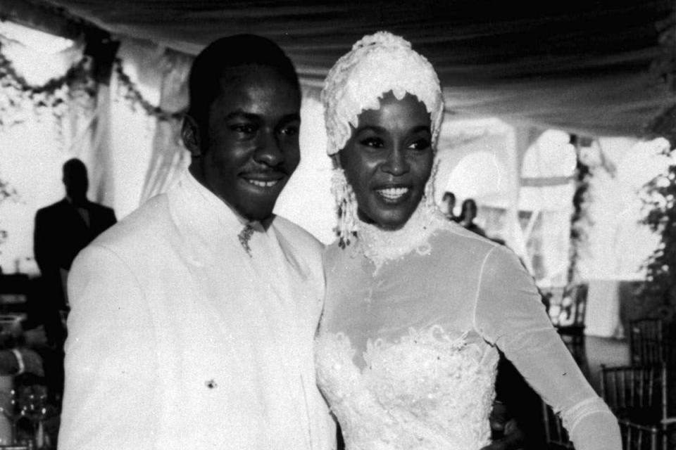 Whitney Houston with her husband Bobby Brown during their 1992 wedding (AP)