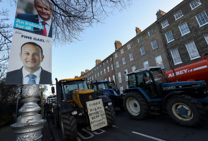 Election posters are seen during farmers' protest near Government Buildings in Dublin