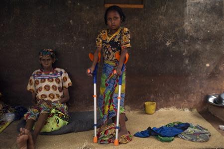 Habiba Hassan, 6, poses for a photograph near Kilometre 12 (PK12) where internally displaced Muslims are stranded due to the ongoing sectarian violence in Bangui March 6, 2014. REUTERS/Siegfried Modola