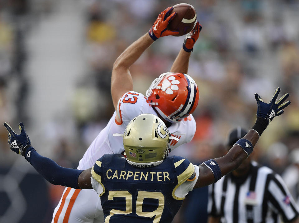 Clemson wide receiver Hunter Renfrow (13) makes a catch against Georgia Tech defensive back Tariq Carpenter (29) during the first half of an NCAA college football game, Saturday, Sept. 22, 2018, in Atlanta. (AP Photo/Mike Stewart)