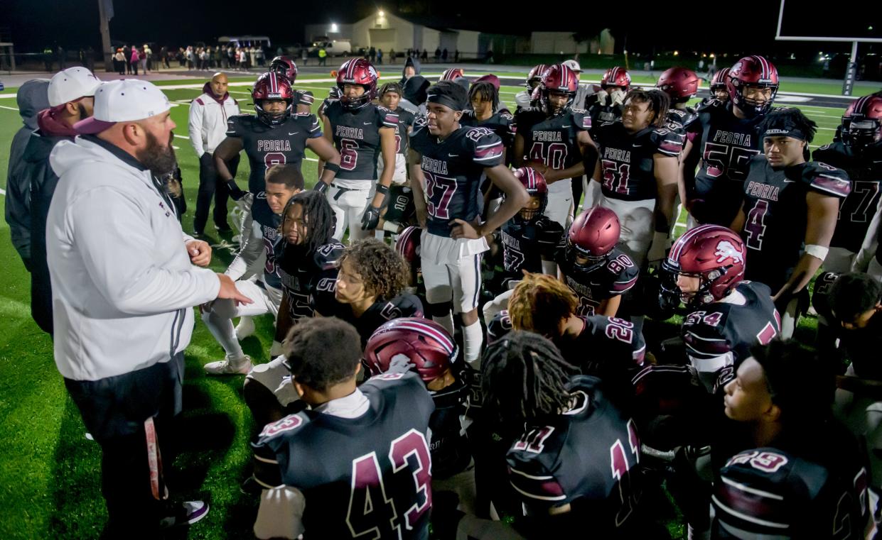 Peoria High head coach Tim Thornton talks with his team after their 40-16 loss to Joliet Catholic in the first round of the Class 5A state football playoffs Friday, Oct. 27, 2023 at Peoria Stadium.