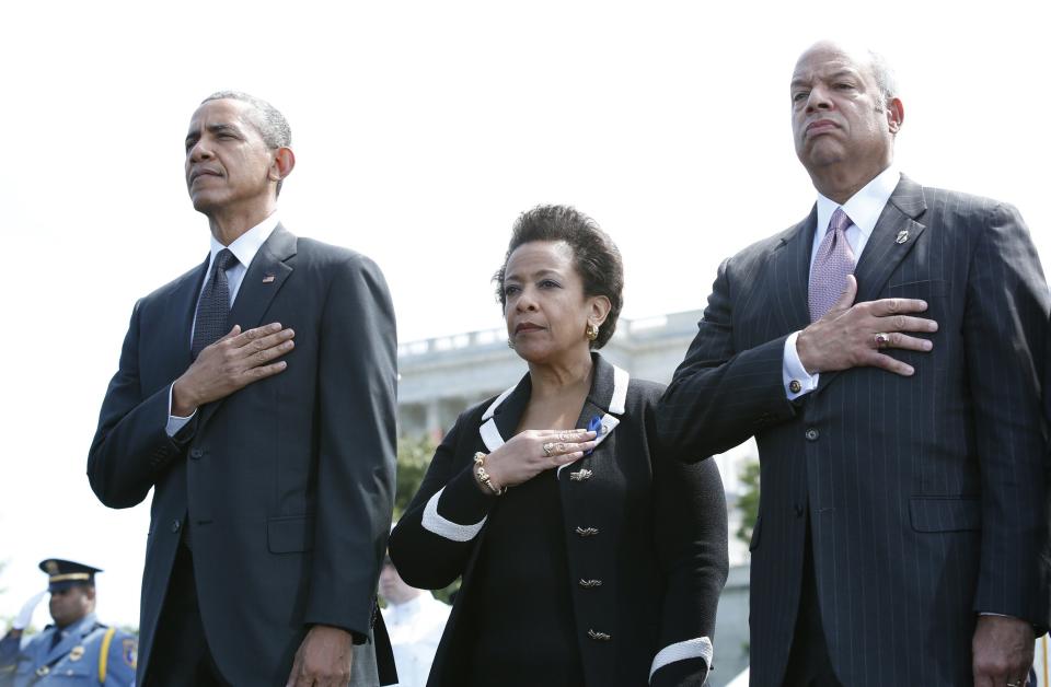 President Barack Obama (from left), Attorney General Loretta Lynch and Department of Homeland Security Secretary Jeh Johnson attend the 34rd Annual National Peace Officers' Memorial Service on Capitol Hill on May 15, 2015.