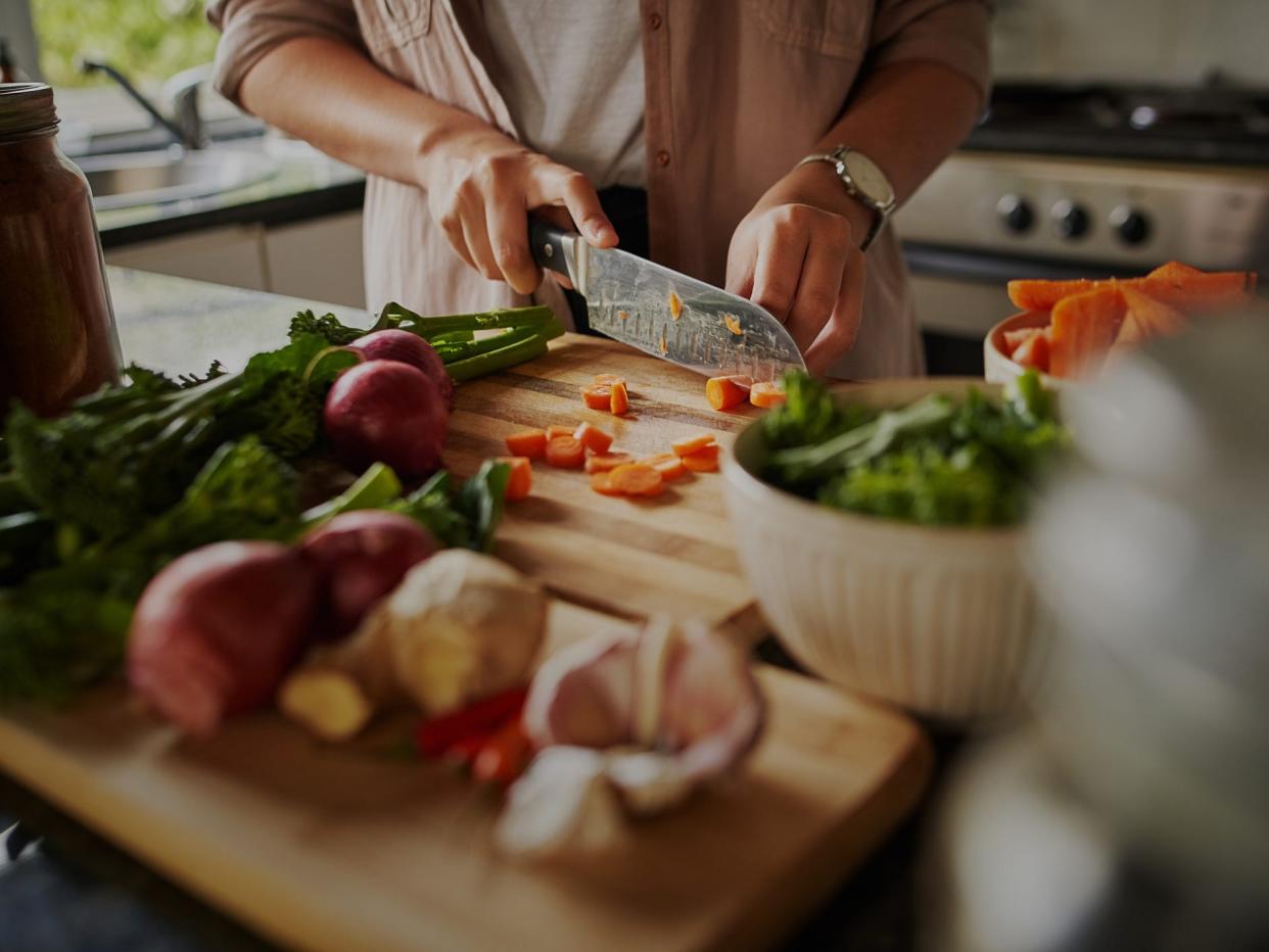 vegan vegetarian cooking chopping vegetables