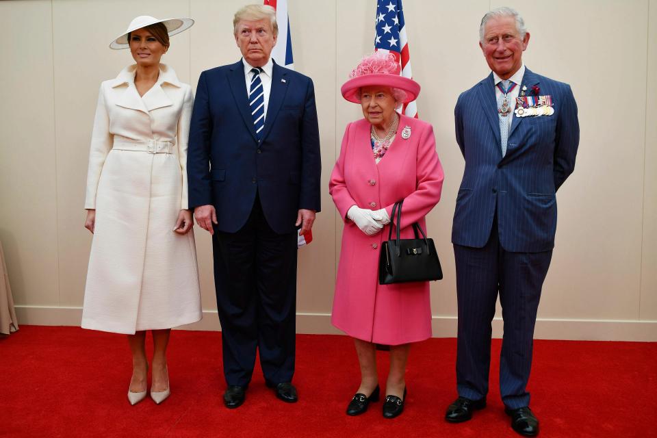 From left, U.S First Lady Melania Trump, U.S President Donald Trump, Britain's Queen Elizabeth and Prince Charles prepare to meet veterans at the commemorations for the 75th Anniversary of the D-Day landings at Southsea Common, Portsmouth, England, Wednesday, June 5, 2019.