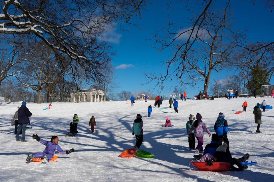 People sled at Sevier Park in Nashville, Tennessee on January 16, 2024.