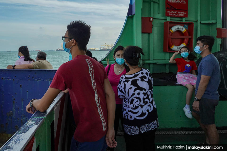 Passengers wearing protective masks on a ferry in Georgetown, Penang on Jan 4, 2021.