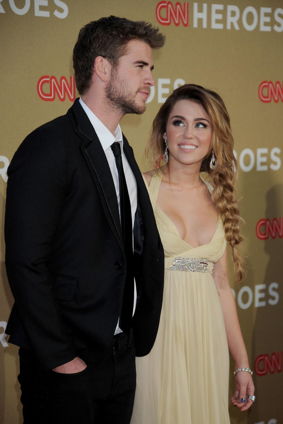 Actor Liam Hemsworth and actress/singer Miley Cyrus arrive at the 2011 CNN Heroes All-Star Tribute at The Shrine Auditorium on Dec. 11, 2011 in Los Angeles, California.&nbsp;