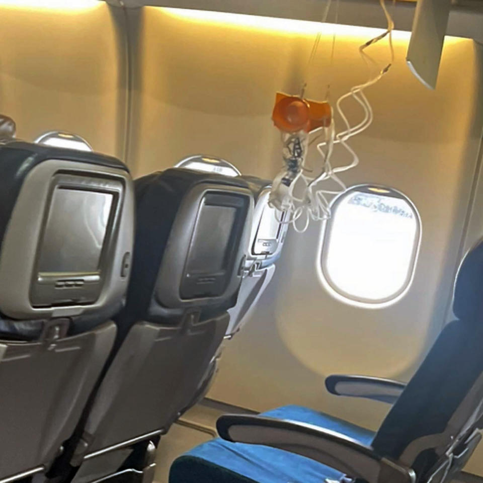 This mobile photo courtesy of passenger Jazmin Bitanga shows the interior of a Hawaiian Airlines plane on its flight from Phoenix to Honolulu, Sunday, Dec. 18, 2022, after severe turbulence rocked the flight. (Courtesy of Jazmin Bitanga via AP)