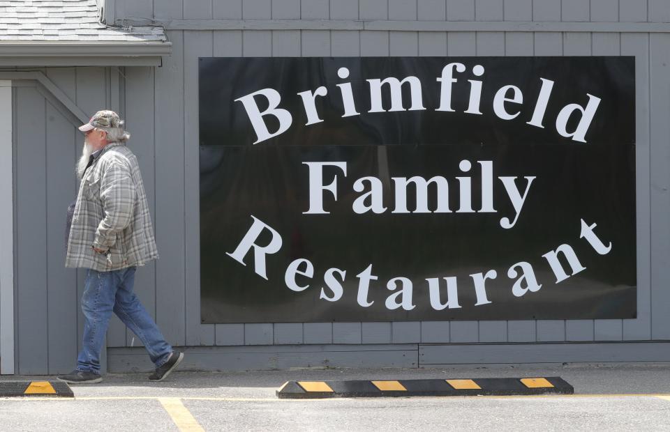 A man enters the Brimfield Family Restaurant on Tuesday.