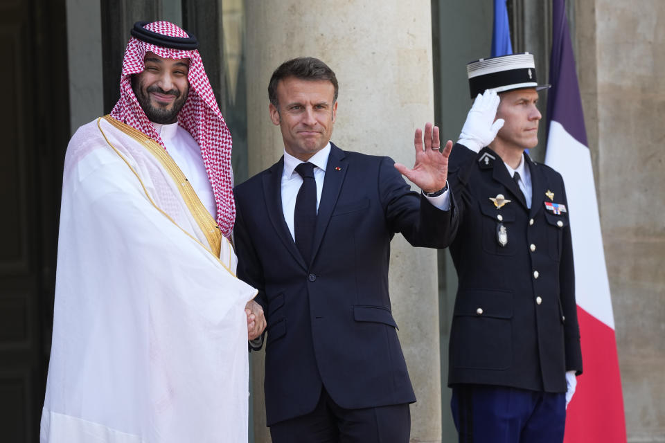Saudi Crown Prince Mohammed bin Salman shakes hands with French President Emmanuel Macron, Friday, June 16, 2023 at the Elysee Palace in Paris. Saudi Crown Prince Mohammed bin Salman meets Emmanuel Macron as part of an official visit, during which he will also participate in a global financing summit aimed at fighting poverty and climate change. (AP Photo/Michel Euler)