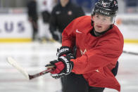 FILE - In this Jan. 1, 2020, file photo, Canada's Alexis Lafreniere shoots during the team's practice at the World Junior Hockey Championships in Ostrava, Czech Republic. The New York Rangers might be on the clock in owning the No. 1 pick in the NHL draft on Tuesday, Oct. 6. That, and the prospect of selecting Quebec star forward Alexis Lafreniere, doesn't mean the still-retooling Rangers will be anywhere closer to being a contender, team president John Davidson cautions. (Ryan Remiorz/The Canadian Press via AP, File)