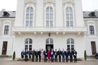 Newly appointed Slovak Prime Minister Igor Matovic (C-L), leader of the OLaNO anti-graft party and President Zuzana Caputova (C-R) pose with Ministers of the new four-party coalition government after a swearing in ceremony on March 21, 2020 outside the Presidential palace in Bratislava. - The ceremony was held without members of the press and all appointed government members wore gloves and face mask to prevent the spread of novel coronavirus. (Photo by JOE KLAMAR / AFP) (Photo by JOE KLAMAR/AFP via Getty Images)