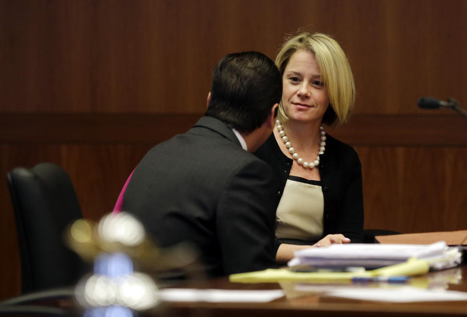 New Jersey Gov. Chris Christie's former Deputy Chief of Staff Bridget Anne Kelly waits in court for a hearing Tuesday, March 11, 2014, in Trenton, N.J. Attorneys for Kelly and two-time campaign manager Bill Stepien are in court to try to persuade a judge not to force them to turn over text messages and other private communications to New Jersey legislators investigating the political payback scandal ensnaring Christie's administration. (AP Photo/Mel Evans, Pool)