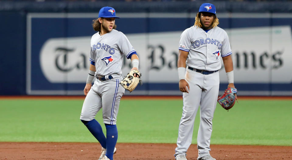 ST. PETERSBURG, FL - AUG 05: Bo Bichette (11) of the Blue Jays and Vladimir Guerrero Jr. (27) on defense during the MLB regular season game between the Toronto Blue Jays and the Tampa Bay Rays on August 05, 2019, at Tropicana Field in St. Petersburg, FL. (Photo by Cliff Welch/Icon Sportswire via Getty Images)