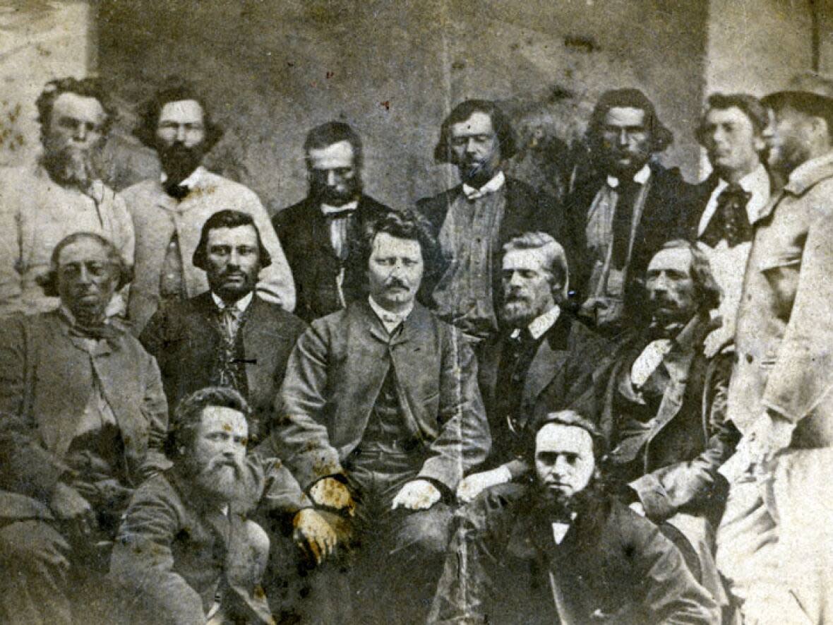 Louis Riel sits in the middle of the councillors of his provisional government during the Red River Resistance in June 1870. He would later go on to lead the Northwest Resistance at Batoche in what is now Saskatchewan. (University of Manitoba Archives and Special Collections - image credit)