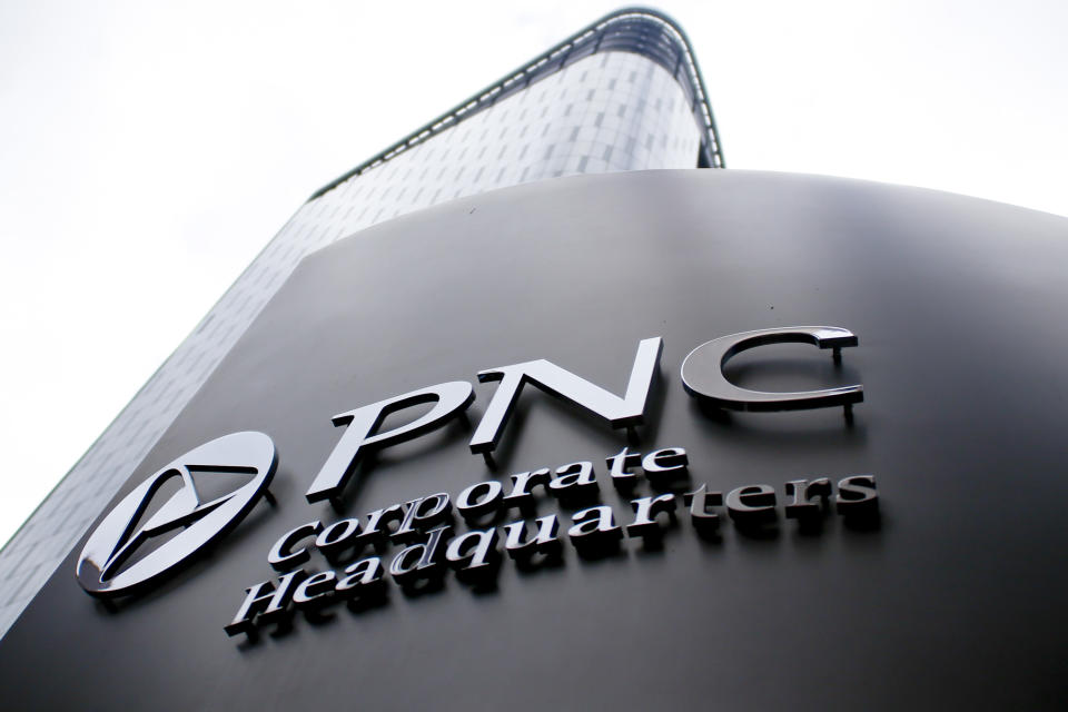 A sign for PNC Corporate Headquarters marks the block where the offices for the banking corporation are in downtown Pittsburgh on Monday, Oct. 16, 2017, in Pittsburgh. (AP Photo/Keith Srakocic)