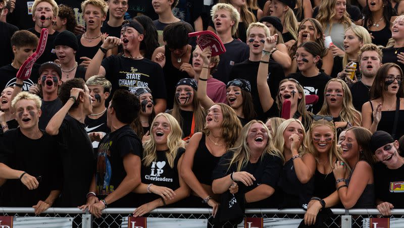 Lone Peak fans cheer on their team in their high school football season opener against Bingham at Lone Peak High School in Highland on Thursday, Aug. 10, 2023.