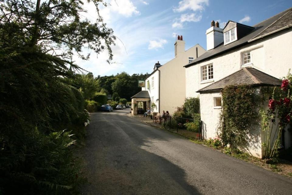 <p>Tucked away in a hamlet, this well-liked <a href="https://www.countryliving.com/uk/travel-ideas/staycation-uk/g38629195/pubs-with-rooms/" rel="nofollow noopener" target="_blank" data-ylk="slk:pub with rooms;elm:context_link;itc:0;sec:content-canvas" class="link ">pub with rooms</a> is the ideal base for exploring the vast wilderness of Dartmoor, where ponies and sheep crop the grasses, and some 129 tors, strange granite outcrops, beg to be climbed. Step out of the door, and within 25 minutes you can be standing on Haytor, enjoying panoramic views as far as the sea. </p><p>The 18-mile Templer Way, a disused granite tramway, leads all the way to Teignmouth. Staff can advise on the best forays for you, including a spring bluebell walk. Bedrooms are cosy and old-fashioned. Two are dog friendly. There is traditional pub grub at lunchtime and more sophisticated cooking at night.</p><p><a class="link " href="https://www.booking.com/hotel/gb/the-rock-inn.en-gb.html?aid=2070935&label=hotels-for-walkers" rel="nofollow noopener" target="_blank" data-ylk="slk:CHECK AVAILABILITY;elm:context_link;itc:0;sec:content-canvas">CHECK AVAILABILITY</a></p>