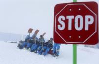 Alpine Skiing - FIS Alpine Skiing World Championships - Men's Downhill - St. Moritz, Switzerland - 11/2/17 - Course workers wait for the fog to disappear. REUTERS/Dominic Ebenbichler