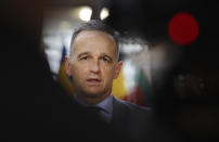 German Foreign Minister Heiko Maas speaks with the media as he arrives for a meeting of EU foreign ministers at the European Council building in Brussels, Monday, May 10, 2021. EU Foreign Affairs Ministers meet in Brussels to discuss current affairs, tensions with Russia, the Western Balkans, transatlantic relations and Belarus. (AP Photo/Olivier Matthys, Pool)