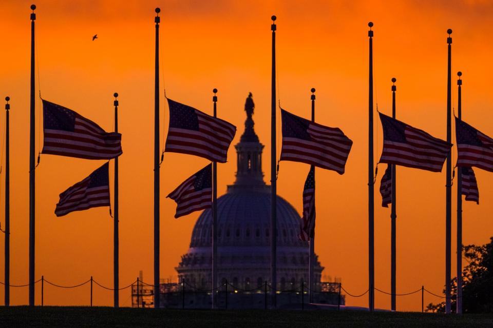 <p>Flags fly at half staff around the Washington Monument at daybreak, June 13, 2016. President Obama ordered flags lowered to honor the victims of the Orlando, Fla., nightclub shootings. (AP/David Ake) </p>