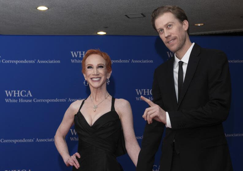 Comedian Kathy Griffin, and Randy Bick, smile while they arrive for the White House Correspondents' Association dinner