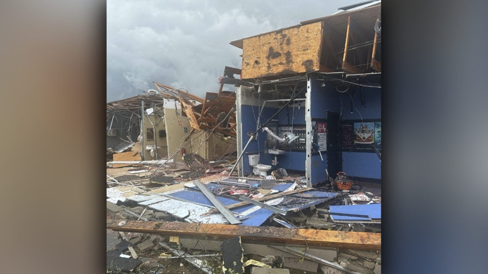 The tornado tore the front wall off a strip mall in downtown Portage.