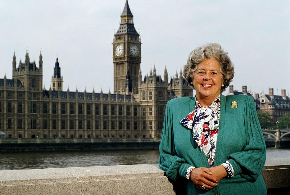 betty boothroyd mp, photographed in front of big beg and the house of commons