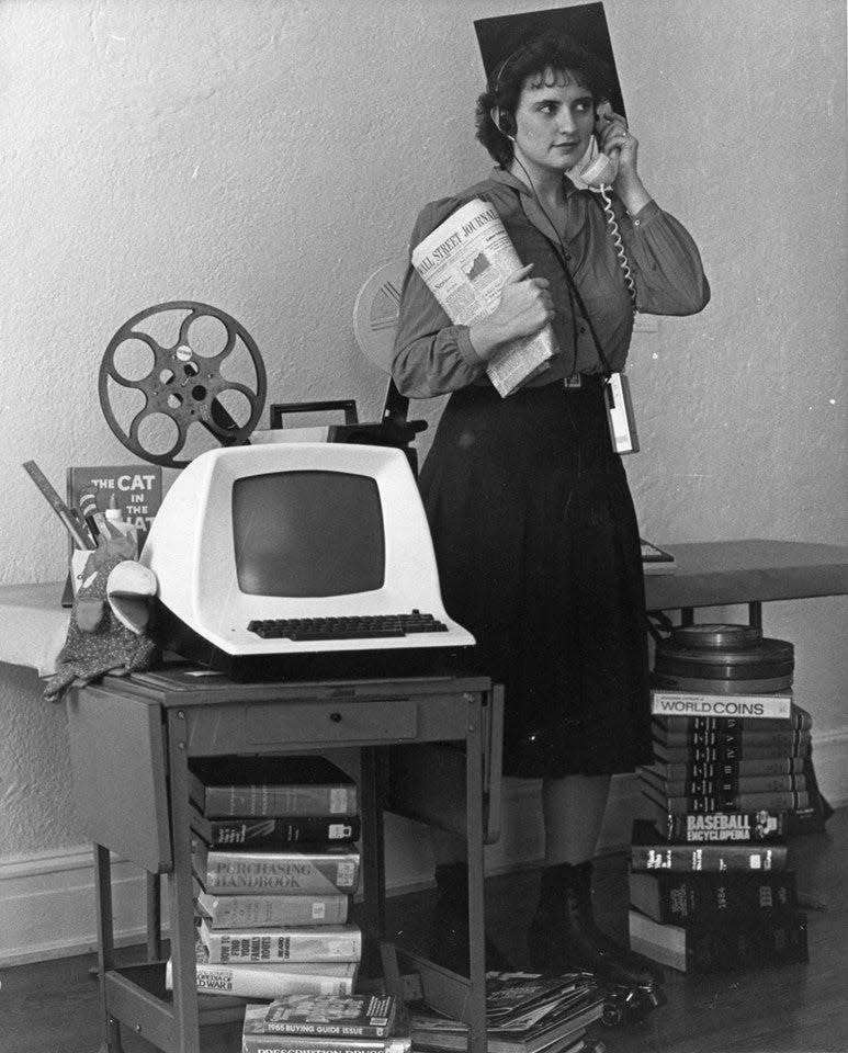 Sherie Brown was a jack of all trades during her 43-year-career at the Massillon Public Library. In this photo she shows off books, computers, film materials offered at the library while wearing roller skates.