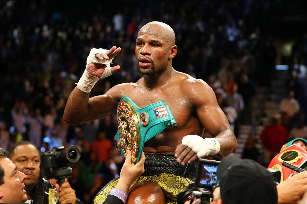 LAS VEGAS, NV - MAY 04:  Floyd Mayweather Jr. celebrates his unanimous-decision victory over Robert Guerrero in their WBC welterweight title bout at the MGM Grand Garden Arena on May 4, 2013 in Las Vegas, Nevada.  (Photo by Al Bello/Getty Images)