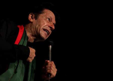 Chairman of the Pakistan Tehreek-e-Insaf (PTI) political party Imran Khan addresses his supporters during what has been dubbed a "freedom march" in Islamabad August 20, 2014. REUTERS/Faisal Mahmood/File Photo