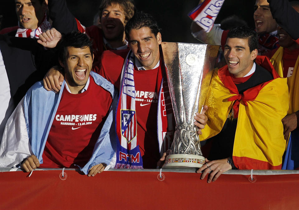 Aguero, Raul Garcia and Reyes celebrate with the trophy at the Neptuno fountain in Madrid the day after Atletico won the UEFA Europa League Cup final in 2010. (Photo by Angel Martinez/Getty Images)