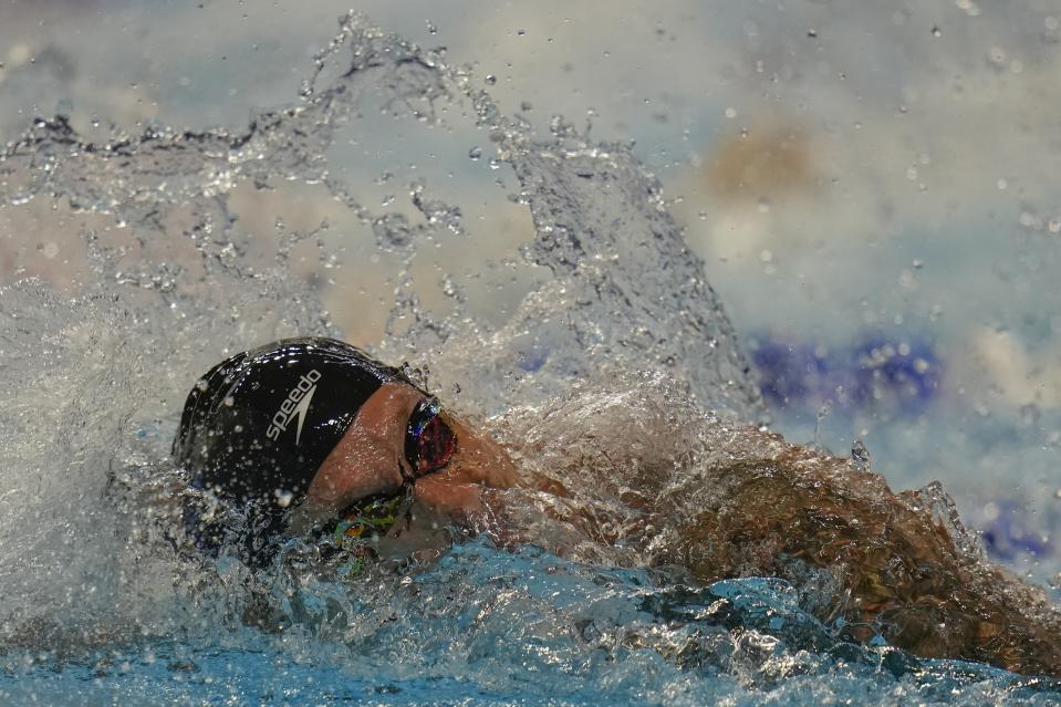 Caeleb Dressel participates in the men's 100 freestyle during wave 2 of the U.S. Olympic Swim Trials on Wednesday, June 16, 2021, in Omaha, Neb. (AP Photo/Jeff Roberson)