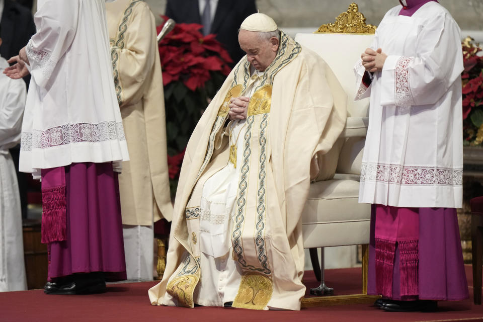 Pope Francis holds a Mass for the solemnity of St. Mary at the beginning of the new year, in St. Peter's Basilica at the Vatican, Sunday, Jan. 1, 2023. Pope Emeritus Benedict XVI, the German theologian who will be remembered as the first pope in 600 years to resign, has died, the Vatican announced Saturday. He was 95. (AP Photo/Andrew Medichini)